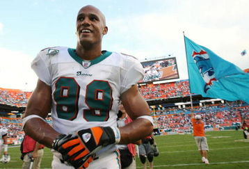 MIAMI - DECEMBER 16:  Defensive end Jason Taylor #99 of the Miami Dolphins celebrates after defeating the Baltimore Ravens at Dolphin Stadium December 16, 2007 in Miami, Florida. The Dolphins defeated the Ravens 22-16 for their first victory of the year.  (Photo by Doug Benc/Getty Images)
