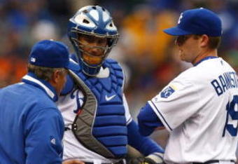 KANSAS CITY, MO - APRIL 8:  Pitching coach Bob McClure meets with catcher John Buck #14 and Brian Bannister #19 of the Kansas City Royals during the game against the New York Yankees on April 8, 2008 at Kauffman Stadium in Kansas City, Missouri.  (Photo by G. Newman Lowrance/Getty Images)