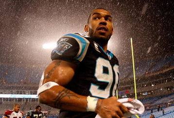 CHARLOTTE, NC - JANUARY 10:  Julius Peppers #89 of the Carolina Panthers walks off the field in the rain after being defeated by the Arizona Cardinals 33-13 in the NFC Divisional Playoff Game on January 10, 2009 at Bank of America Stadium in Charlotte, North Carolina.  (Photo by Streeter Lecka/Getty Images)