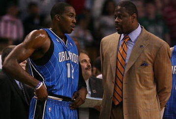 BOSTON - MAY 06:  Assistant coach Patrick Ewing talks with Dwight Howard #12 of the Orlando Magic in the first quarter against the Boston Celtics in Game Two of the Eastern Conference Semifinals during the 2009 NBA Playoffs at TD Banknorth Garden on May 6, 2009 in Boston, Massachusetts.  NOTE TO USER: User expressly acknowledges and agrees that, by downloading and or using this photograph, User is consenting to the terms and conditions of the Getty Images License Agreement.  (Photo by Elsa/Getty Images)