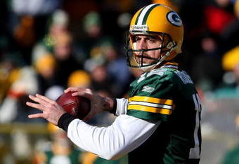 GREEN BAY, WI - DECEMBER 28: Aaron Rodgers #12 of the Green Bay Packers looks for a receiver against the Detroit Lions on December 28, 2008 at Lambeau Field in Green Bay, Wisconsin. The Packers defeated the Lions 31-21. (Photo by Jonathan Daniel/Getty Images)