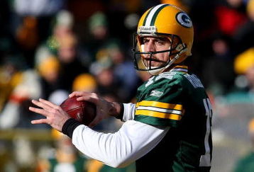 GREEN BAY, WI - DECEMBER 28: Aaron Rodgers #12 of the Green Bay Packers looks for a receiver against the Detroit Lions on December 28, 2008 at Lambeau Field in Green Bay, Wisconsin. The Packers defeated the Lions 31-21. (Photo by Jonathan Daniel/Getty Images)