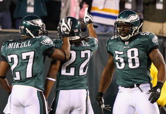 PHILADELPHIA - DECEMBER 15:  Asante Samuel #22 of the Philadelphia Eagles celebrates with Quintin Mikell #27 and Trent Cole #58 after an interception for a touchdown against the Cleveland Browns on December 15, 2008 at Lincoln Financial Field in Philadelphia, Pennsylvania.  (Photo by Jim McIsaac/Getty Images)