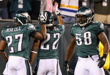 PHILADELPHIA - DECEMBER 15:  Asante Samuel #22 of the Philadelphia Eagles celebrates with Quintin Mikell #27 and Trent Cole #58 after an interception for a touchdown against the Cleveland Browns on December 15, 2008 at Lincoln Financial Field in Philadelphia, Pennsylvania.  (Photo by Jim McIsaac/Getty Images)