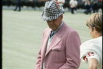 Coach Bear Bryant of the Alabama Crimson Tide watches his players during a game.