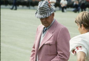 Coach Bear Bryant of the Alabama Crimson Tide watches his players during a game.