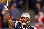 FOXBORO, MA - DECEMBER 23:  Kelley Washington #15 of the New England Patriots tries to fire up the crowd at the start of the game against the Miami Dolphins at Gillette Stadium on December 23, 2007 in Foxboro, Massachusetts.  (Photo by Jim McIsaac/Getty Images)