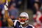 FOXBORO, MA - DECEMBER 23:  Kelley Washington #15 of the New England Patriots tries to fire up the crowd at the start of the game against the Miami Dolphins at Gillette Stadium on December 23, 2007 in Foxboro, Massachusetts.  (Photo by Jim McIsaac/Getty Images)