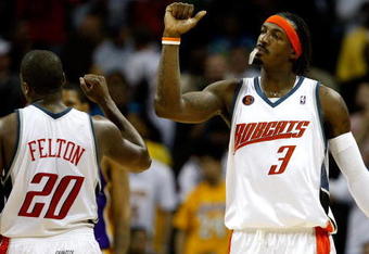 CHARLOTTE, NC - MARCH 31:  Gerald Wallace #3 and Raymond Felton #20 of the Charlotte Bobcats react after a play during their game against the Los Angeles Lakers at Time Warner Cable Arena on March 31, 2009 in Charlotte, North Carolina.  NOTE TO USER: User expressly acknowledges and agrees that, by downloading and/or using this Photograph, user is consenting to the terms and conditions of the Getty Images License Agreement.  (Photo by Streeter Lecka/Getty Images)