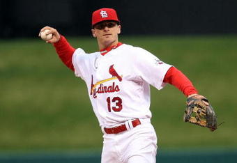 ST. LOUIS - APRIL 06:  Brendan Ryan #13 of the St. Louis Cardinals sends the ball to first against the Pittsburgh Pirates during Opening Day on April 6, 2009  at Busch Stadium in St. Louis, Missouri. The Pittsburgh Pirates defeated the St. Louis Cardinals 6-4.  (Photo by Elsa/Getty Images)
