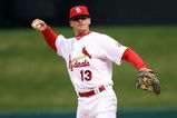 ST. LOUIS - APRIL 06:  Brendan Ryan #13 of the St. Louis Cardinals sends the ball to first against the Pittsburgh Pirates during Opening Day on April 6, 2009  at Busch Stadium in St. Louis, Missouri. The Pittsburgh Pirates defeated the St. Louis Cardinals 6-4.  (Photo by Elsa/Getty Images)