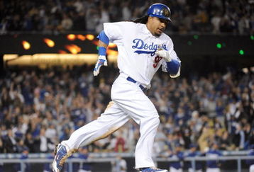 LOS ANGELES, CA - APRIL 30:  Manny Ramirez #99 of the Los Angeles Dodgers hits a homerun for a 4-3 lead against the San Diego Padres during the third inning at Dodger Stadium on April 30, 2009 in Los Angeles, California.  (Photo by Harry How/Getty Images)