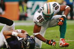 MIAMI - DECEMBER 16:  Defensive end Jason Taylor #99 of the Miami Dolphins celebrates after sacking Kyle Boller #7 of the Baltimore Ravens at Dolphin Stadium December 16, 2007 in Miami, Florida. The Dolphins defeated the Ravens 22-16 for their first victory of the year.  (Photo by Doug Benc/Getty Images)