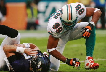 MIAMI - DECEMBER 16:  Defensive end Jason Taylor #99 of the Miami Dolphins celebrates after sacking Kyle Boller #7 of the Baltimore Ravens at Dolphin Stadium December 16, 2007 in Miami, Florida. The Dolphins defeated the Ravens 22-16 for their first victory of the year.  (Photo by Doug Benc/Getty Images)
