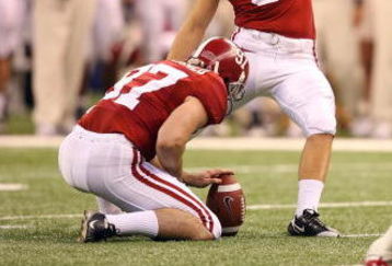 NEW ORLEANS - JANUARY 02:  Kicker Leigh Tiffin #99 of the Alabama Crimson Tide converts a 52-yard field goal in the first half against the Utah Utes during the 75th Allstate Sugar Bowl at the Louisiana Superdome on January 2, 2009 in New Orleans, Louisiana.  (Photo by Matthew Stockman/Getty Images)