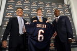 LAKE FOREST, IL - APRIL 3:  Chicago Bears general manager Jerry Angelo, quarterback Jay Cutler and head coach Lovie Smith are all smiles after introducing Cutler as their new quarterback during a press conference on April 3, 2009 at Halas Hall in Lake Forest, Illinois. (Photo by Jim Prisching/Getty Images)