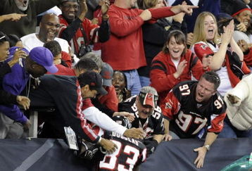ATLANTA - NOVEMBER 23: Wide receiver Harry Douglas #83 of the Atlanta Falcons celebrates a touchdown return against the Carolina Panthers with fans at the Georgia Dome on November 23, 2008 in Atlanta, Georgia.  (Photo by Al Messerschmidt/Getty Images)