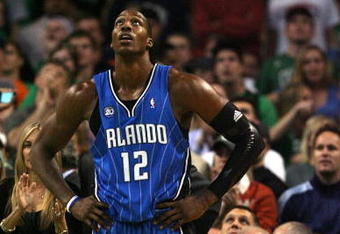 BOSTON - MAY 12:  Dwight Howard #12 of the Orlando Magic reacts after he is called for a foul in the second half against the Boston Celtics in Game Five of the Eastern Conference Semifinals during the 2009 NBA Playoffs at TD Banknorth Garden May 12, 2009 in Boston, Massachusetts. The Celtics defeated the Magic 92-88.  NOTE TO USER: User expressly acknowledges and agrees that, by downloading and or using this photograph, User is consenting to the terms and conditions of the Getty Images License Agreement.  (Photo by Elsa/Getty Images)
