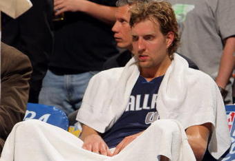 DENVER - MAY 13:  Dirk Nowitzki #41 of the Dallas Mavericks sits on the bench late in the game against  the Denver Nuggets in Game Five of the Western Conference Semifinals during the 2009 NBA Playoffs at Pepsi Center on May 13, 2009 in Denver, Colorado. The Nuggets defeated the Mavericks 124-110 to advance to the Western Conference Finals. NOTE TO USER: User expressly acknowledges and agrees that, by downloading and or using this photograph, User is consenting to the terms and conditions of the Getty Images License Agreement.  (Photo by Doug Pensinger/Getty Images)