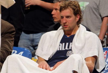 DENVER - MAY 13:  Dirk Nowitzki #41 of the Dallas Mavericks sits on the bench late in the game against  the Denver Nuggets in Game Five of the Western Conference Semifinals during the 2009 NBA Playoffs at Pepsi Center on May 13, 2009 in Denver, Colorado. The Nuggets defeated the Mavericks 124-110 to advance to the Western Conference Finals. NOTE TO USER: User expressly acknowledges and agrees that, by downloading and or using this photograph, User is consenting to the terms and conditions of the Getty Images License Agreement.  (Photo by Doug Pensinger/Getty Images)