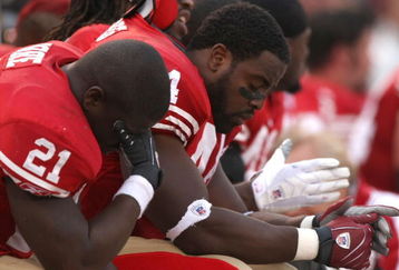 SAN FRANCISCO - NOVEMBER 18:  Frank Gore #21 and Moran Norris #44 of the San Francisco 49ers sit on the bench in the fourth quarter against the St. Louis Rams at Monster Park November 18, 2007 in San Francisco, California.  (Photo by Jed Jacobsohn/Getty Images)
