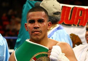 LAS VEGAS - APRIL 08:  Juan Diaz celebrates his victory against Jose Miguel Cotto during the WBA Lightweight Championship fight at Thomas & Mack Arena on April 8, 2006 in Las Vegas, Nevada. Diaz defeated Cotto by decision to remain champion.  (Photo by Al Bello/Getty Images)