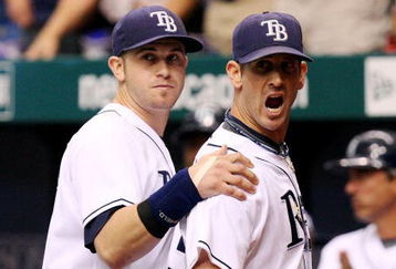 ST PETERSBURG, FL - OCTOBER 02:  Relief pitcher Grant Balfour #50 of the Tampa Bay Rays is held back by Evan Longoria #3 as he yells back to Orlando Cabrera #18 of the Chicago White Sox after ending the inning with a strike-out in Game 1 of the American Leaugue Divisional Series at Tropicana Field on October 2, 2008 in St. Petersburg, Florida. The Rays defeated the White Sox 6-4.  (Photo by Doug Benc/Getty Images)