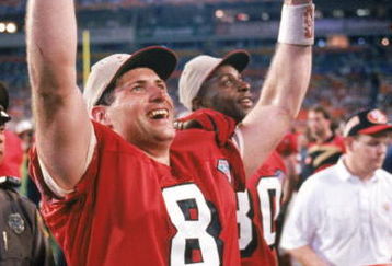 MIAMI - JANUARY 29:  Quarterback Steve Young #8 of the San Francisco 49ers celebrates following their Super Bowl XXIX against the San Diego Chargers at Joe Robbie Stadium on January 29, 1995 in Miami, Florida. The 49ers won 49-26. (Photo by George Rose/Getty Images)