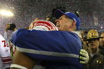 GLENDALE, AZ - FEBRUARY 03: Head coach Tom Coughlin of the New York Giants hugs Osi Umenyiora #72 after the Giants defeated the New England Patriots 17-14 during Super Bowl XLII on February 3, 2008 at the University of Phoenix Stadium in Glendale, Arizona.  (Photo by Donald Miralle/Getty Images)