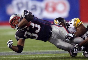 FOXBORO, MA - NOVEMBER 30:  Kevin Faulk #33 of the New England Patriots is taken down by James Harrison #92 of the Pittsburgh Steelers on November 30, 2008 at Gillette Stadium in Foxboro, Massachusetts.  (Photo by Elsa/Getty Images)