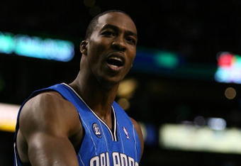 BOSTON - MAY 12:  Dwight Howard #12 of the Orlando Magic reacts after he is called for a foul in the second half against the Boston Celtics in Game Five of the Eastern Conference Semifinals during the 2009 NBA Playoffs at TD Banknorth Garden May 12, 2009 in Boston, Massachusetts. The Celtics defeated the Magic 92-88.  NOTE TO USER: User expressly acknowledges and agrees that, by downloading and or using this photograph, User is consenting to the terms and conditions of the Getty Images License Agreement.  (Photo by Elsa/Getty Images)
