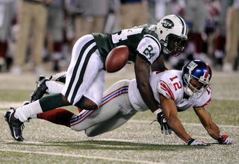 EAST RUTHERFORD, NJ - AUGUST 23:  Darrelle Revis #24 of the New York Jets breaks up a pass intended for Steve Smith #12 of the New York Giants during a preseason NFL game at Giants Stadium in the Meadowlands August 23, 2008 in East Rutherford, New Jersey.  (Photo by Jeff Zelevansky/Getty Images)