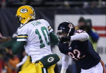 CHICAGO - DECEMBER 22: Matt Flynn #10 of the Green Bay Packers runs for a first down on a fake punt against the Chicago Bears on December 22, 2008 at Soldier Field in Chicago, Illinois. The Bears defeated the Packers 20-17 in overtime. (Photo by Jonathan Daniel/Getty Images)