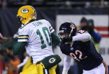 CHICAGO - DECEMBER 22: Matt Flynn #10 of the Green Bay Packers runs for a first down on a fake punt against the Chicago Bears on December 22, 2008 at Soldier Field in Chicago, Illinois. The Bears defeated the Packers 20-17 in overtime. (Photo by Jonathan Daniel/Getty Images)