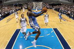 DALLAS - MAY 11:  Guard J.R. Smith #1 of the Denver Nuggets takes a shot against Dirk Nowitzki #41 of the Dallas Mavericks in Game Four of the Western Conference Semifinals during the 2009 NBA Playoffs at American Airlines Center on May 11, 2009 in Dallas, Texas. NOTE TO USER: User expressly acknowledges and agrees that, by downloading and or using this photograph, User is consenting to the terms and conditions of the Getty Images License Agreement.  (Photo by Ronald Martinez/Getty Images)