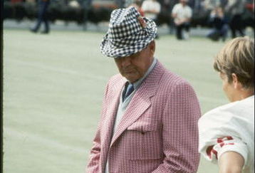 Coach Bear Bryant of the Alabama Crimson Tide watches his players during a game.