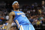 DALLAS - MAY 09:  Forward Carmelo Anthony #15 of the Denver Nuggets reacts during play against the Dallas Mavericks in Game Three of the Western Conference Semifinals during the 2009 NBA Playoffs at American Airlines Center on May 9, 2009 in Dallas, Texas. NOTE TO USER: User expressly acknowledges and agrees that, by downloading and or using this photograph, User is consenting to the terms and conditions of the Getty Images License Agreement.  (Photo by Ronald Martinez/Getty Images)