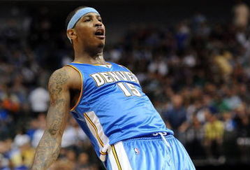 DALLAS - MAY 09:  Forward Carmelo Anthony #15 of the Denver Nuggets reacts during play against the Dallas Mavericks in Game Three of the Western Conference Semifinals during the 2009 NBA Playoffs at American Airlines Center on May 9, 2009 in Dallas, Texas. NOTE TO USER: User expressly acknowledges and agrees that, by downloading and or using this photograph, User is consenting to the terms and conditions of the Getty Images License Agreement.  (Photo by Ronald Martinez/Getty Images)