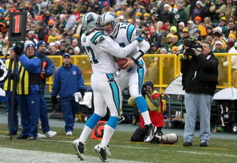 GREEN BAY, WI - NOVEMBER 30:  Jake Delhomme #17 and Jeff King #47 of the Carolina Panthers celebrate after Delhomme scored a 1-yard rushing touchdown in the second quarter against the Green Bay Packers at Lambeau Field on November 30, 2008 in Green Bay, Wisconsin.  (Photo by Jonathan Daniel/Getty Images)