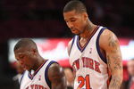 NEW YORK - MARCH 20:  Nate Robinson #4 of the New York Knicks walks from the court with teammate Wilson Chandler #21 against the Sacramento Kingson March 20, 2009 at Madison Square Garden in New York City. NOTE TO USER: User expressly acknowledges and agrees that, by downloading and or using this photograph, User is consenting to the terms and conditions of the Getty Images License Agreement.  (Photo by Nick Laham/Getty Images)