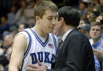 DURHAM, NC - FEBRUARY 07:  Coach Mike Krzyzewski (R) consoles Greg Paulus #3 of the Duke University Blue Devils after Paulus fouled out against the North Carolina Tar Heels during their game on February 7, 2007 at Cameron Indoor Stadium in Durham, North Carolina.  North Carolina defeated Duke, 79-73.  (Photo by Grant Halverson/Getty Images)