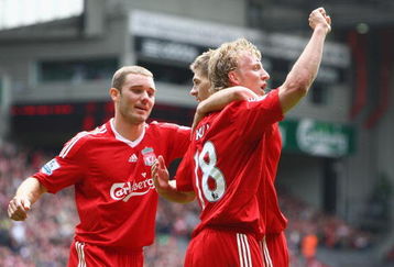 LIVERPOOL, UNITED KINGDOM - MAY 03:  Dirk Kuyt of Liverpool celebrates with team mates Steven Gerrard and Fabio Aurelio (L) after scoring his team's second goal during the Barclays Premier League match between Liverpool and Newcastle United at Anfield on May 3, 2009 in Liverpool, England. (Photo by Clive Brunskill/Getty Images)