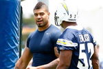 SAN DIEGO - MAY 03: Linebackers Shawne Merriman #56 and Larry English #52 of the San Diego Chargers have a discussion during minicamp at the Chargers training facility on May 3, 2009 in San Diego, California. (Photo by Kevin Terrell/Getty Images)