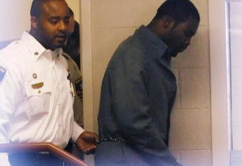 Sussex, VA - NOVEMBER 25:  Suspended Atlanta Falcons quarterback Michael Vick (R) leaves Surry County Circuit Court after entering a guilty plea on two felony counts connected to dog fighting on November 25, 2008 in Sussex, Virginia. Under a plea agreement, Vick, who is currently serving a term in prison for federal dog fighting charges, will serve one-year of probation for the state charges. He is scheduled to be released on July of 2009.  (Photo by Geoff Burke/Getty Images)