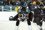 PHILADELPHIA - JANUARY 18:  Free safety Clinton Hart #33 of the Philadelphia Eagles sits next to wide receiver Greg Lewis #83 during the NFC Championship game against the Carolina Panthers at Lincoln Financial Field on January 18, 2004 in Philadelphia, Pennsylvania.  The Panthers defeated the Eagles 14-3.  (Photo by Doug Pensinger/Getty Images)  