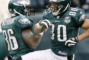 PHILADELPHIA - DECEMBER 9: Jake Westbrook #36 and Kevin Curtis #80 of the Philadelphia Eagles celebrate Westbrook's touchdown in the NFL game against the New York Giants at the Lincoln Financial Field on December 9, 2007 in Philadelphia, Pennsylvania. (Photo by Jeff Zelevansky/Getty Images)
