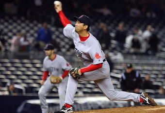 NEW YORK - MAY 05:  Takashi Saito #24 of the Boston Red Sox pitches against the New York Yankees on May 5, 2009 at Yankee Stadium in the Bronx borough of New York City. The Red Sox defeated the Yankees 7-3.  (Photo by Jim McIsaac/Getty Images)