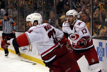 BOSTON - MAY 14:  Scott Walker #24 and Ray Whitney #13 of the Carolina Hurricanes celebrate Walker's game winning goal in overtime against the Boston Bruins during Game Seven of the Eastern Conference Semifinal Round of the 2009 Stanley Cup Playoffs on May 14, 2009 at the TD Banknorth Garden in Boston, Massachusetts. The Hurricanes defeated the Bruins 3-2 in overtime. (Photo by Elsa/Getty Images)