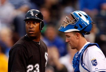 KANSAS CITY, MO - MAY 05:  Jermaine Dye #23 of the Chicago White Sox watches the replay on the scoreboard after hitting a two-run home run as catcher John Buck #14 looks on during the third inning against the Kansas City Royals on May 5, 2009 at Kauffman Stadium in Kansas City, Missouri.  (Photo by Jamie Squire/Getty Images)