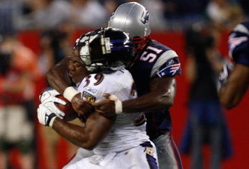FOXBORO, MA - AUGUST 7: Ray Rice #39 of the Baltimore Ravens has his helmet knocked off as he is tackled by Jerod Mayo #51 of the New England Patriots during the preseason game at Gillette Stadium on August 7, 2008 in Foxboro, Massachusetts. (Photo by Jim Rogash/Getty Images)